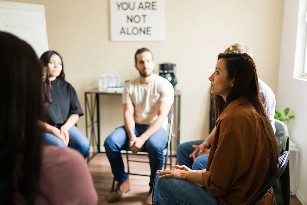 Group of individuals engaging in nature therapy as part of a part-time day treatment program in Massachusetts.